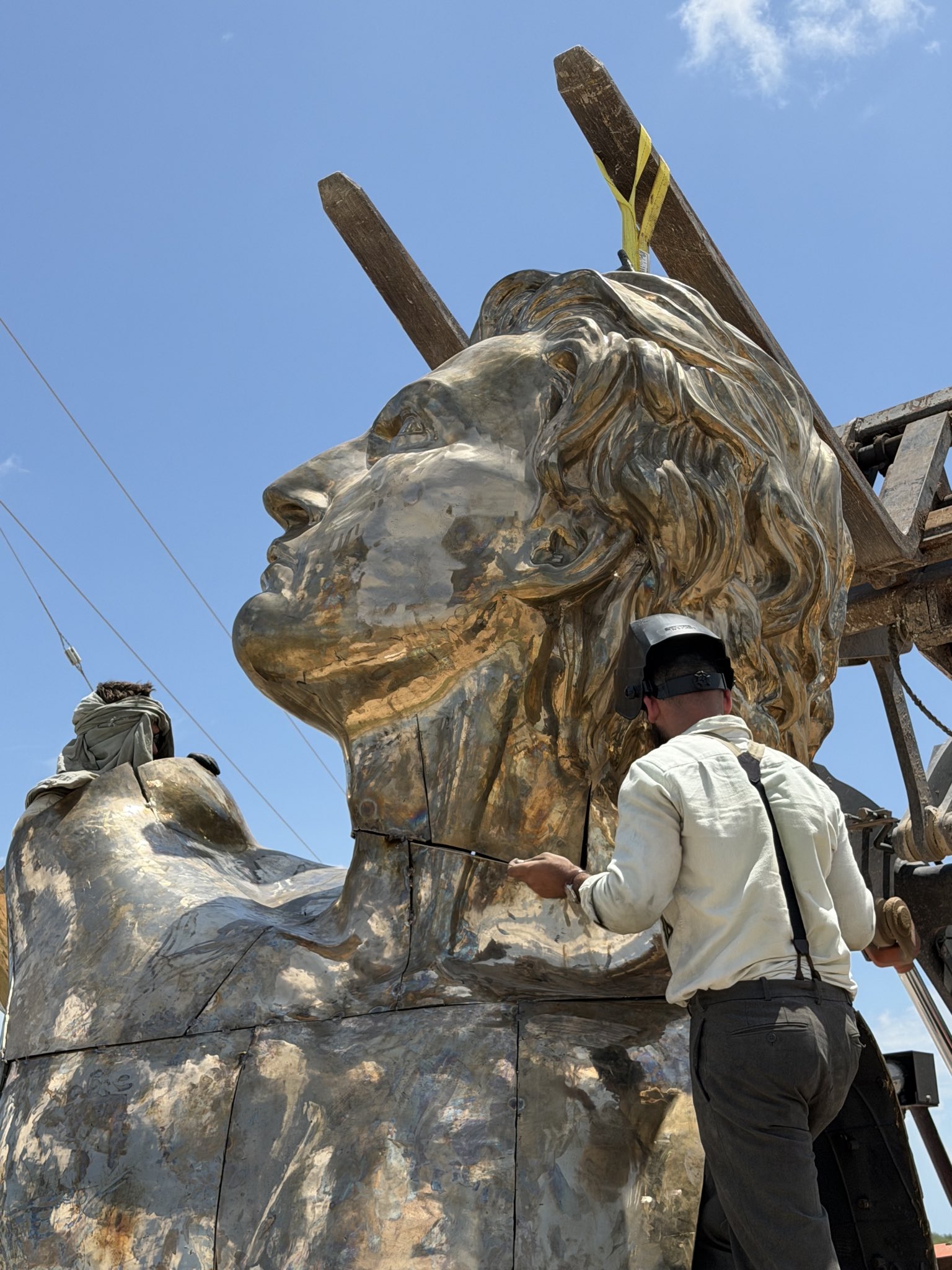 Craftsmen at work on the Prometheus titanium statue — Atelier Missor